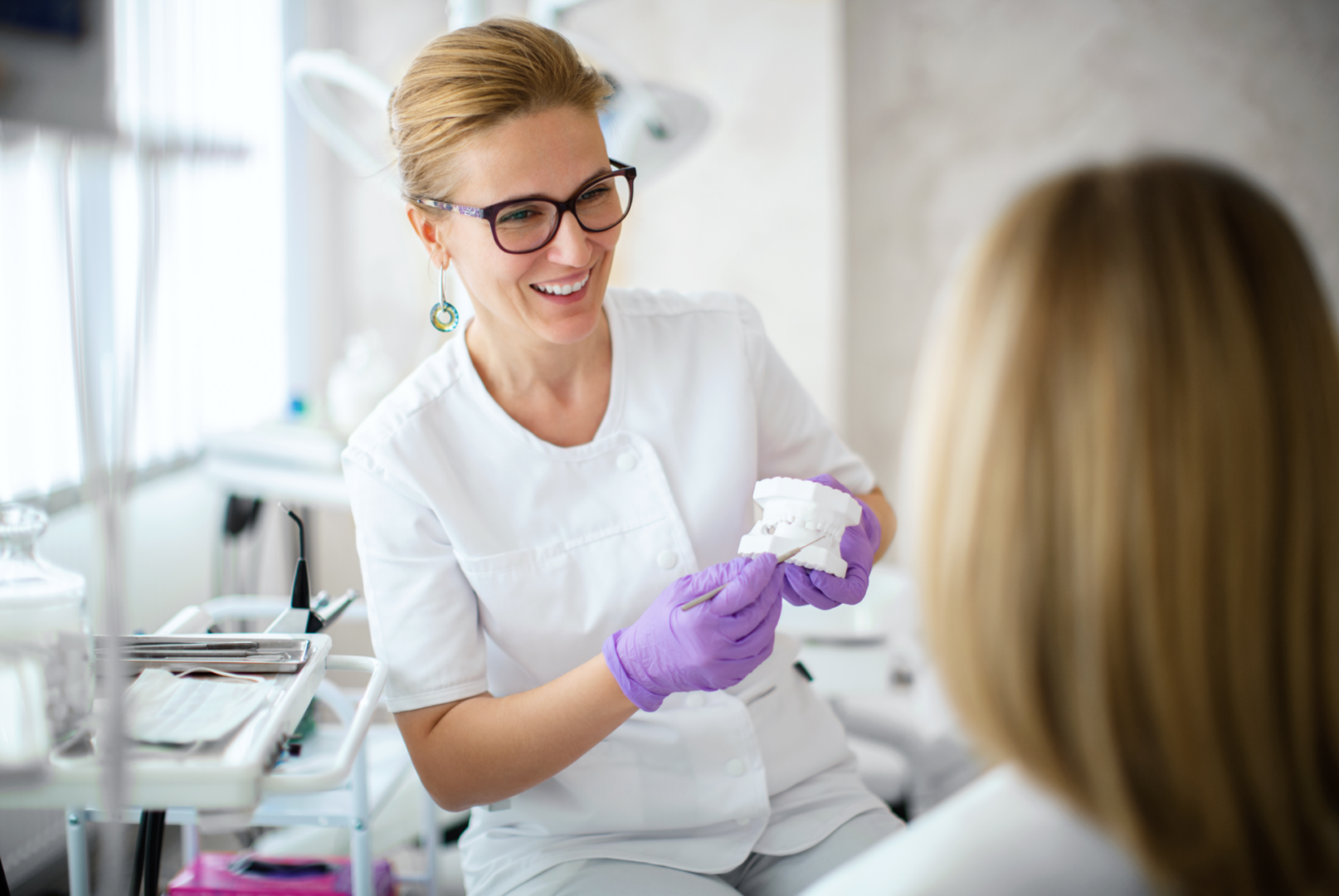 Dental professional with tooth mold