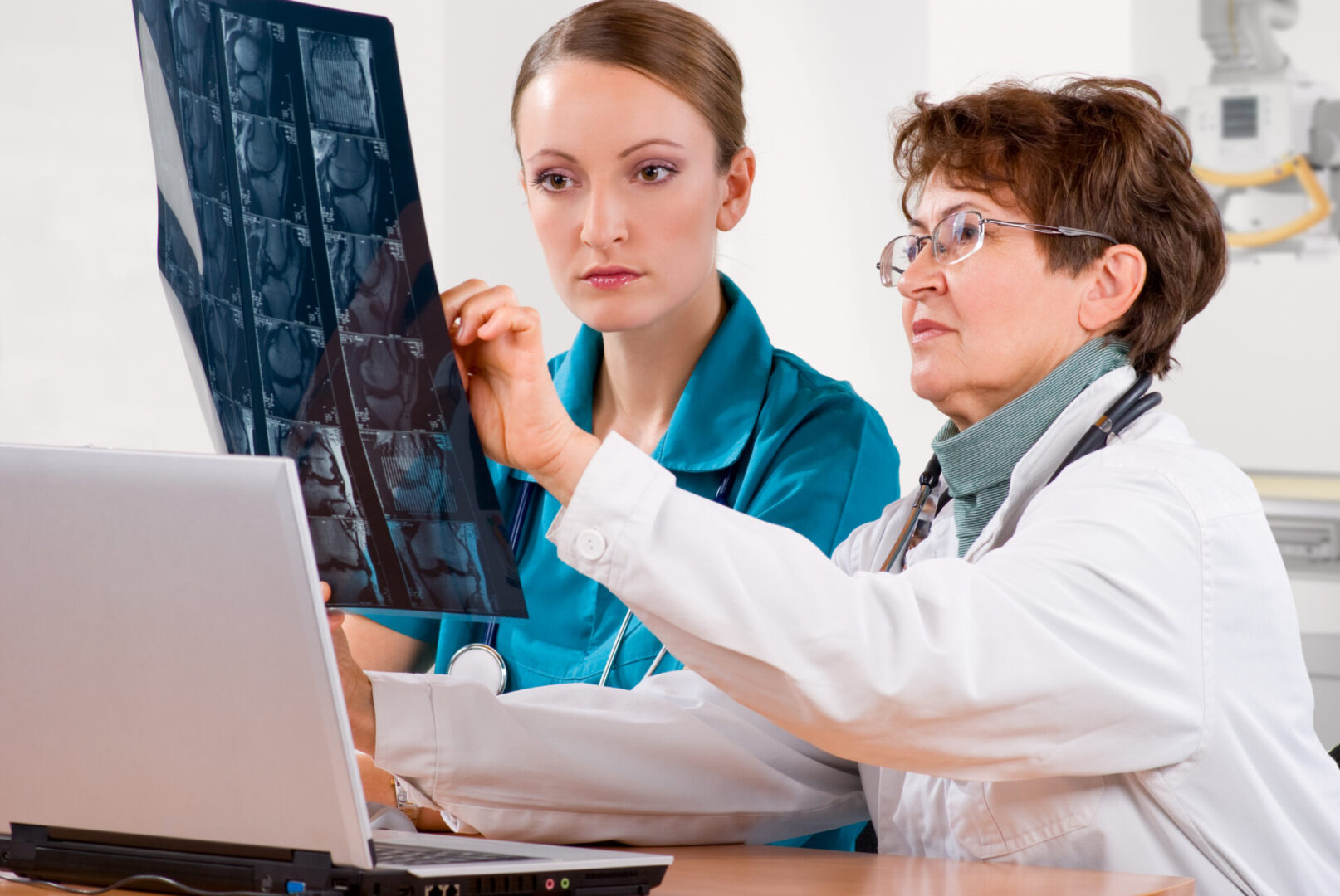 Healthcare workers analyzing radiology scan