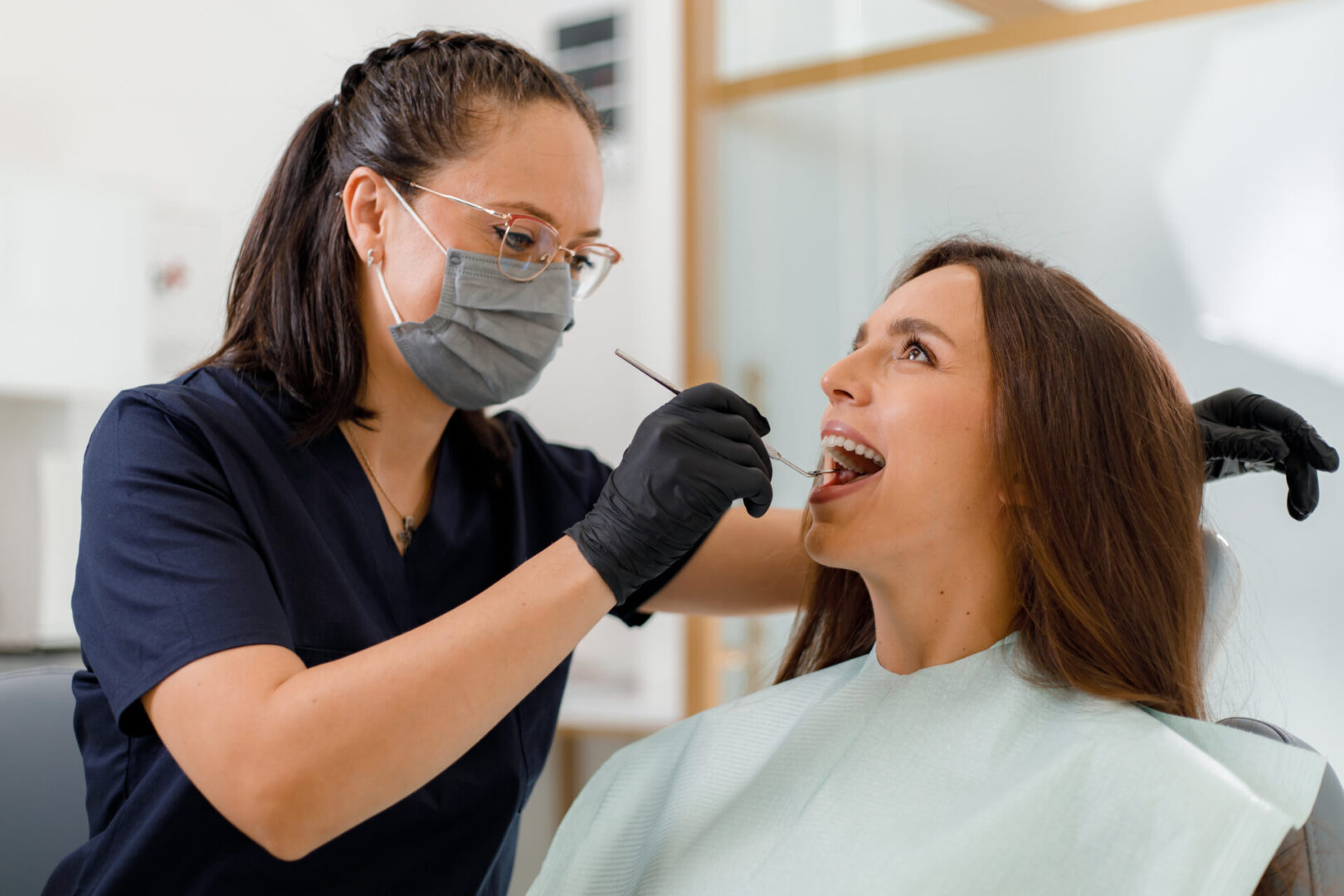 Dental professional with patient